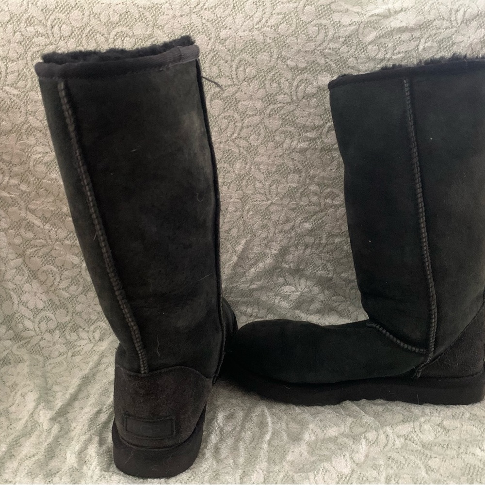 Tall black UGG boots